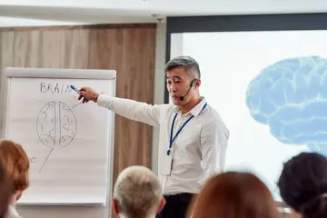 a teacher using a classroom laser pointer