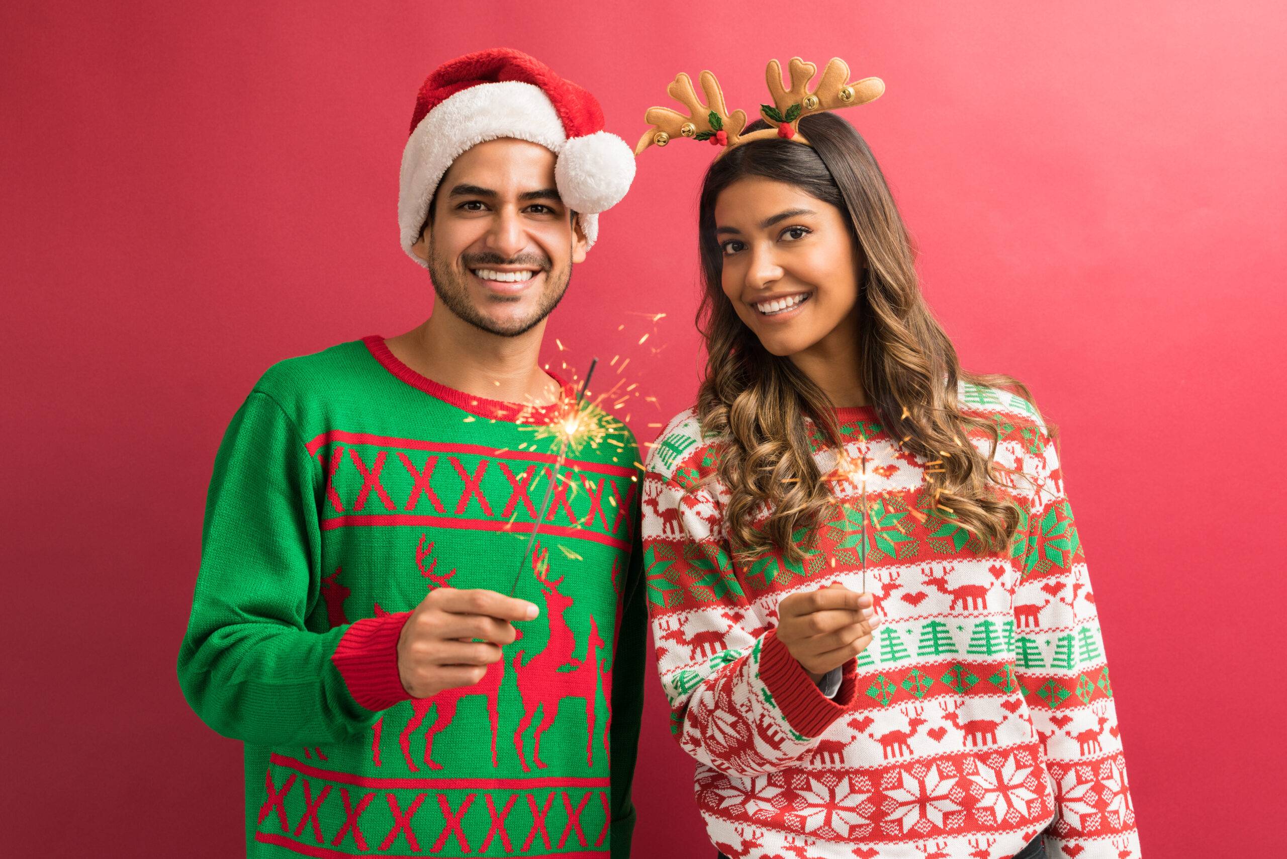 ugly sweater day means wearing ugly holiday sweaters as this man and woman are.