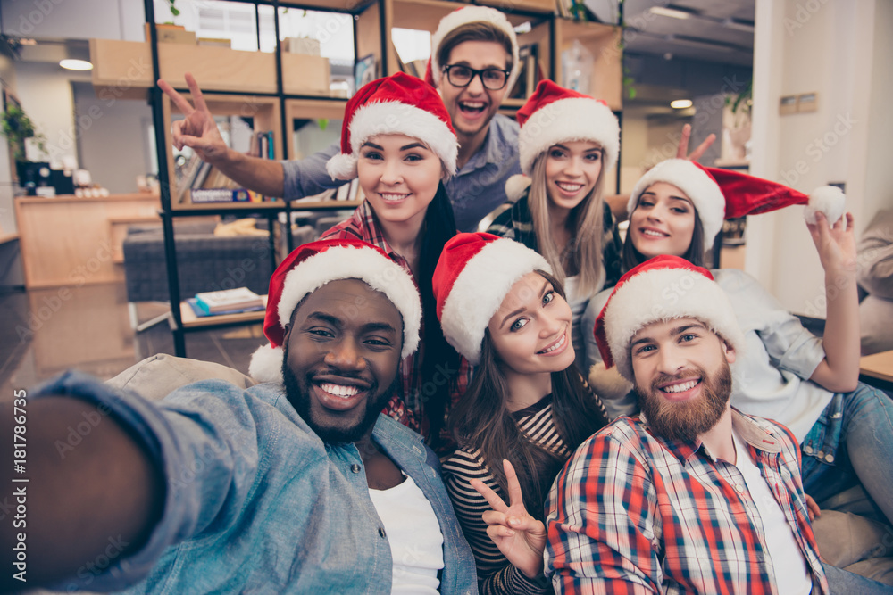 What is the best secret santa gift 2023? Maybe one of these coworkers in santa hats can tell you.